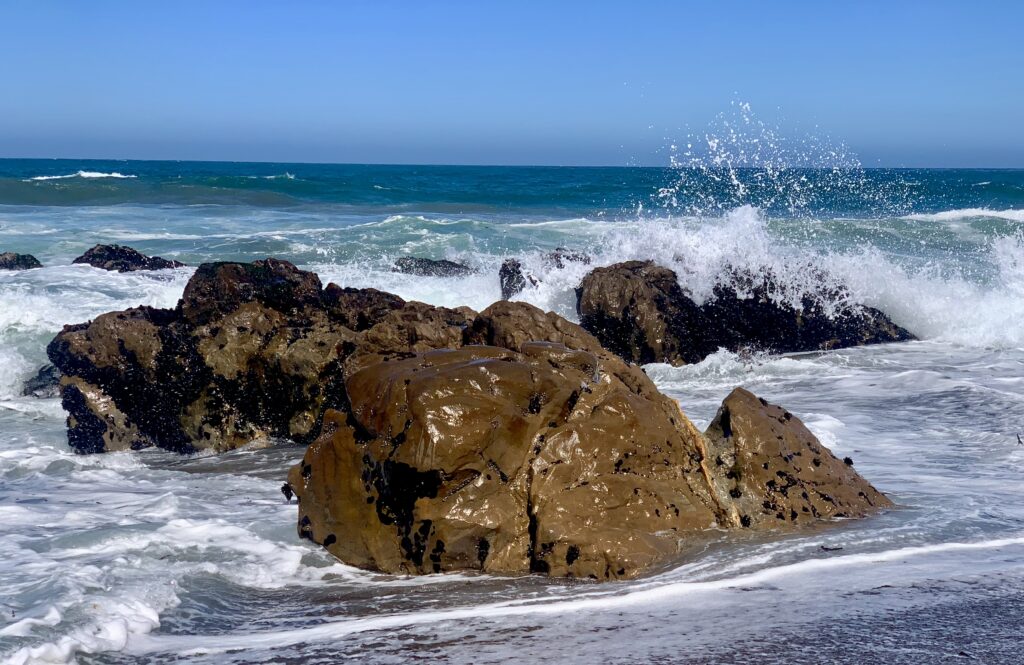 Waves and rocks on a beach